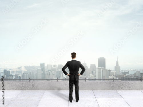 Photo: businessman on the roof businessman on the roof