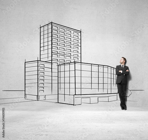 Photo: businessman and drawing skyscraper businessman and drawing skyscraper