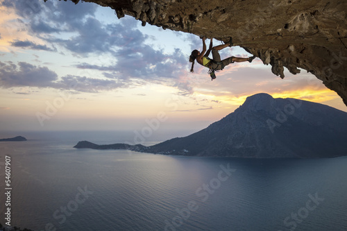 Photo: Young female rock climber at sunset, Kalymnos Island, Greece Young female rock climber at sunset, Kalymnos Island, Greece