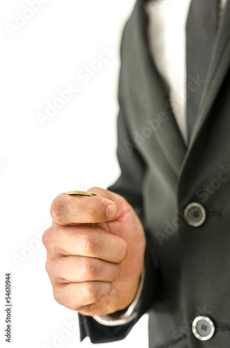 Photo: Businessman tossing a coin Businessman tossing a coin