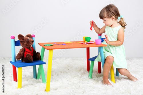 Photo: Little cute girl sitting Little cute girl sitting