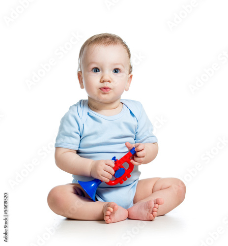 Photo: smiling boy baby with musical toys. Isolated on white backgroun smiling boy baby with musical toys. Isolated on white backgroun