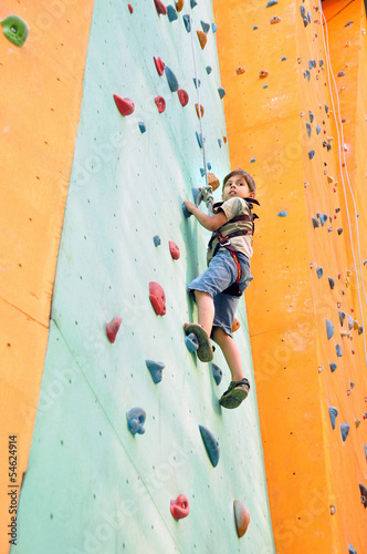 Photo: child climbing up the wall child climbing up the wall