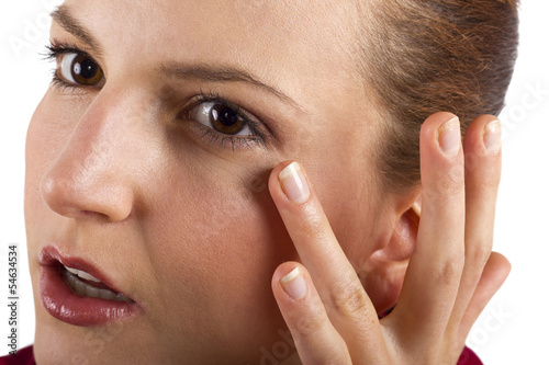 Photo: woman applying anti aging cream ointments woman applying anti aging cream ointments