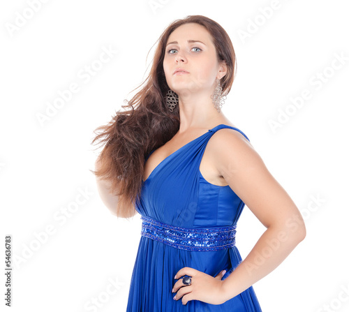 Photo: Portrait of a beautiful young woman in blue dress Portrait of a beautiful young woman in blue dress