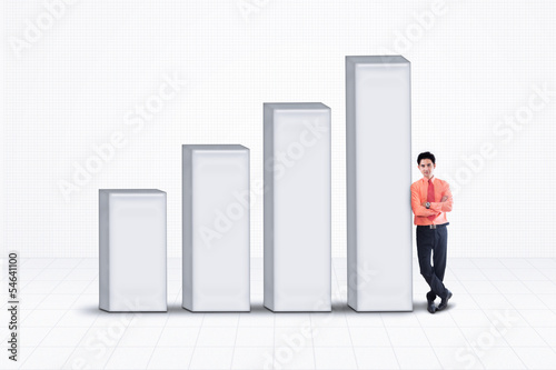 Photo: Businessman and bar chart - isolated Businessman and bar chart - isolated