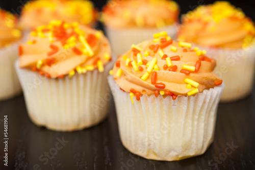 Photo: Cupcakes with Orange Icing Cupcakes with Orange Icing