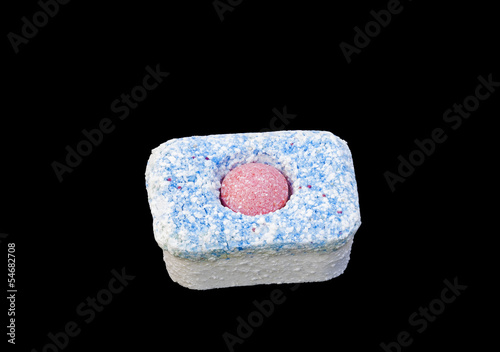 Photo: dishwasher detergent tablet macro isolated dishwasher detergent tablet macro isolated