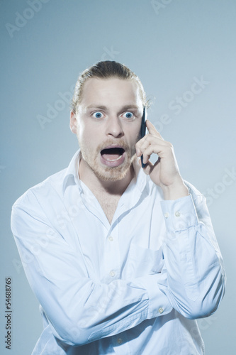 Photo: Very angry man on telepone Very angry man on telepone