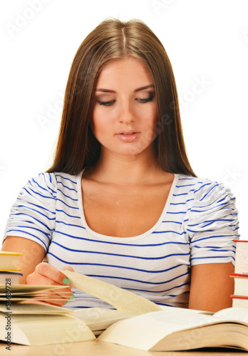 Photo: Young woman reading a book. Female student learning Young woman reading a book. Female student learning