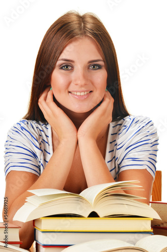 Photo: Young woman reading a book. Female student learning Young woman reading a book. Female student learning