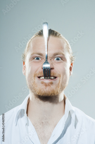 Photo: humorous man with fork humorous man with fork