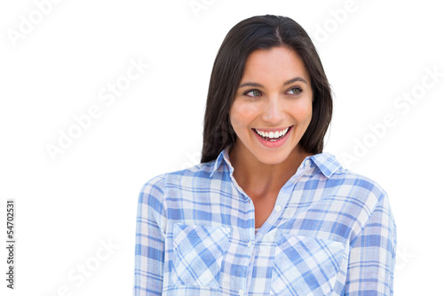 Photo: Young woman smiling and looking away Young woman smiling and looking away