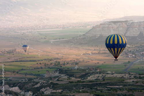 Photo: Hot air balloons rise over valley, Turkey Hot air balloons rise over valley, Turkey