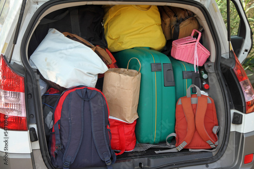 Photo: Car full of suitcases and bags to return from holidays Car full of suitcases and bags to return from holidays