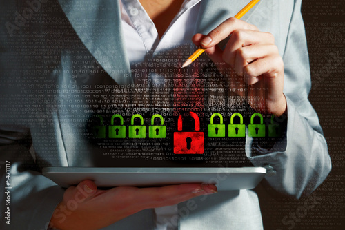 Photo: Businesswoman holding tablet pc Businesswoman holding tablet pc