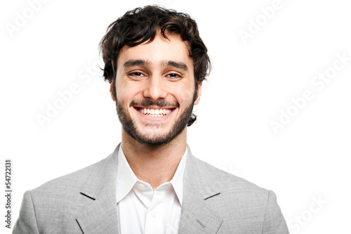 Photo: Smiling businessman isolated on white Smiling businessman isolated on white
