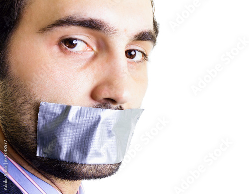 Photo: Businessman with duct tape on mouth Businessman with duct tape on mouth