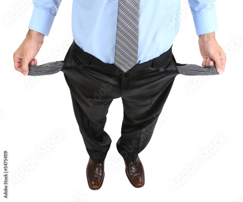 Photo: Business man showing his empty pockets, isolated on white Business man showing his empty pockets, isolated on white