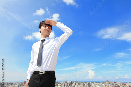 Photo: business man looking away to copy space business man looking away to copy space