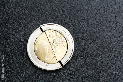Photo: Euro crisis - broken coin Euro crisis - broken coin