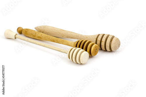 Photo: Honey dippers on a white background Honey dippers on a white background