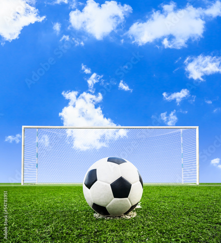 Photo: soccer ball on green grass field soccer ball on green grass field