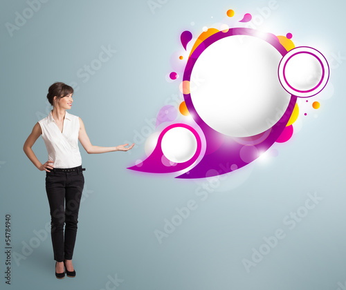 Photo: Attractive woman presenting abstract speech bubble copy space Attractive woman presenting abstract speech bubble copy space