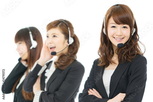 Photo: Beautiful asian business operator isolated on white background Beautiful asian business operator isolated on white background
