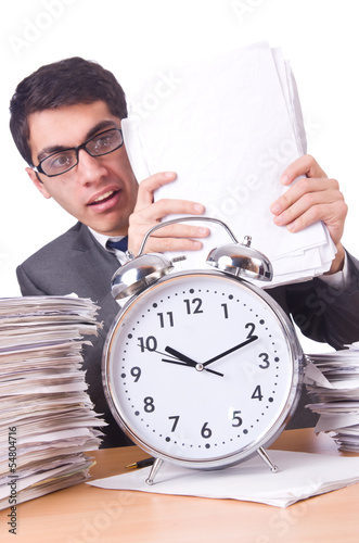 Photo: Woman businessman with giant alarm clock Woman businessman with giant alarm clock