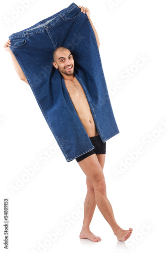 Photo: Man in dieting concept with oversized jeans Man in dieting concept with oversized jeans
