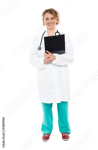 Photo: Smiling physician with clipboard and stethoscope Smiling physician with clipboard and stethoscope