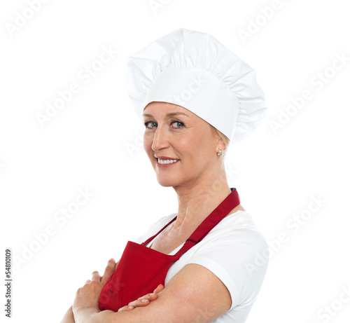 Photo: Middle aged confident female chef posing Middle aged confident female chef posing