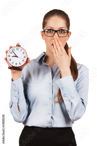 Photo: Young woman with an alarm clock in a hand Young woman with an alarm clock in a hand