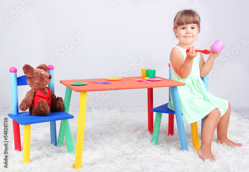 Photo: Little cute girl sitting Little cute girl sitting