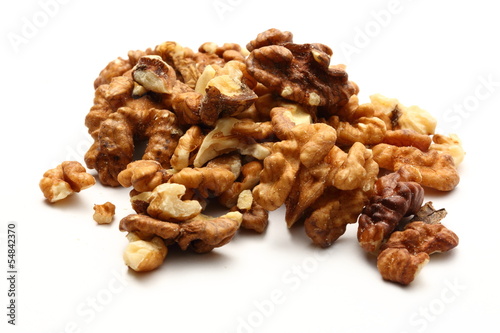Photo: Heap of walnuts on white background Heap of walnuts on white background
