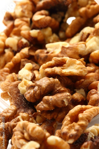 Photo: Heap of walnuts on white background Heap of walnuts on white background