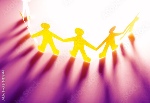 Photo: Paper people in teamworking concept Paper people in teamworking concept