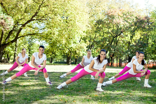 Photo: Group of women stretching legs Group of women stretching legs