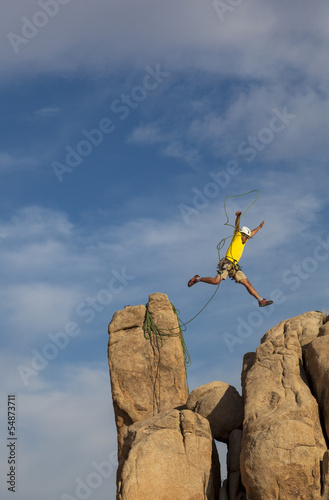 Photo: Successful climber at the top. Successful climber at the top.