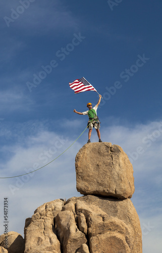 Photo: Successful climber at the top. Successful climber at the top.