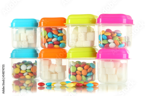 Photo: Full of plastic containers isolated on white Full of plastic containers isolated on white