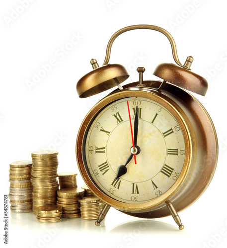 Photo: Antique clock and coins isolated on white Antique clock and coins isolated on white