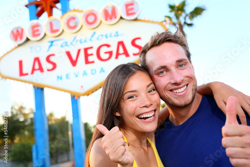 Photo: Las vegas couple happy at sign Las vegas couple happy at sign