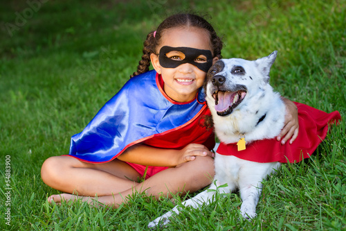 Photo: Pretty mixed race girl hugging her pet Pretty mixed race girl hugging her pet