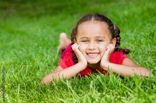 Photo: Summer portrait of pretty mixed race girl outdoors Summer portrait of pretty mixed race girl outdoors