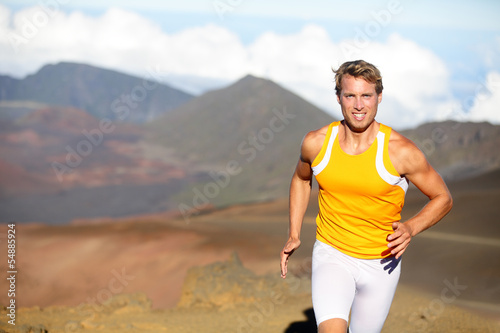 Photo: Running athlete - man runner sprinting fast Running athlete - man runner sprinting fast