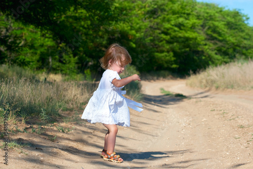 Photo: small child in the white dress small child in the white dress