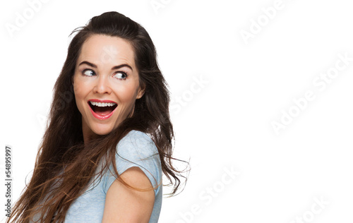 Photo: Surprised woman looking over shoulder Surprised woman looking over shoulder