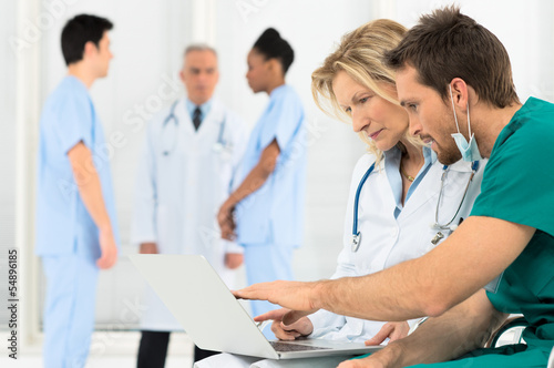 Photo: Doctors Working On Laptop Doctors Working On Laptop